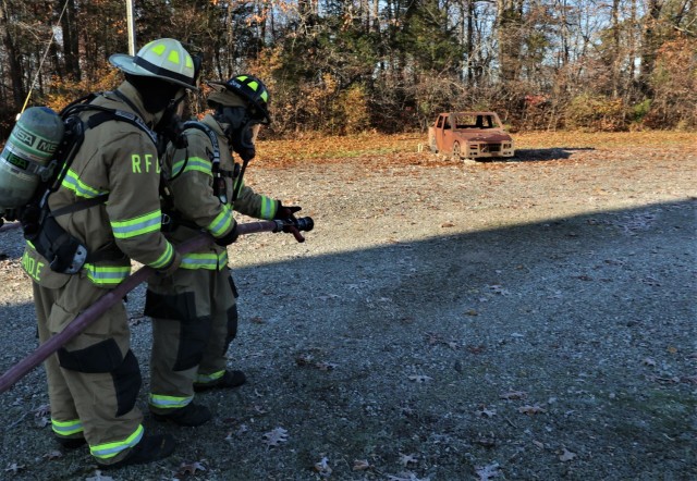 A total of four Fort Knox Middle High School students took turns Nov. 19, 2021 putting out a practice car fire during a firefighting certification program. Each student had a “buddy” veteran firefighter work closely with them during the...