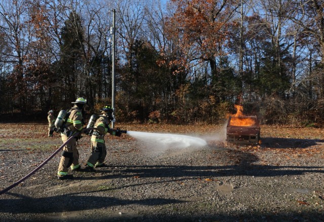 A total of four Fort Knox Middle High School students took turns Nov. 19, 2021 putting out a practice car fire during a firefighting certification program. Each student had a “buddy” veteran firefighter work closely with them during the...
