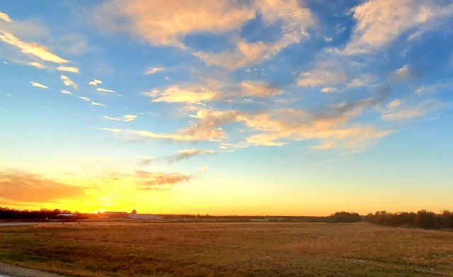 The sun sets behind airport buildings Nov. 9, 2021, at Sparta-Fort McCoy Airport at Fort McCoy, Wis. The airport is often one of the best open areas to catch a colorful sky scene at the installation. Learn more about Fort McCoy online at...