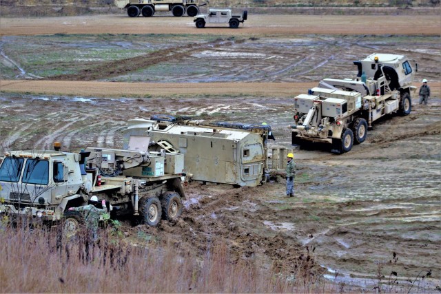 Soldiers at Fort McCoy, Wis., for training in the Regional Training Site-Maintenance Wheeled-Vehicle Recovery Operations Course work together during training Oct. 23, 2020, at the installation Vehicle Recovery Site on North Post. The 17-day course...