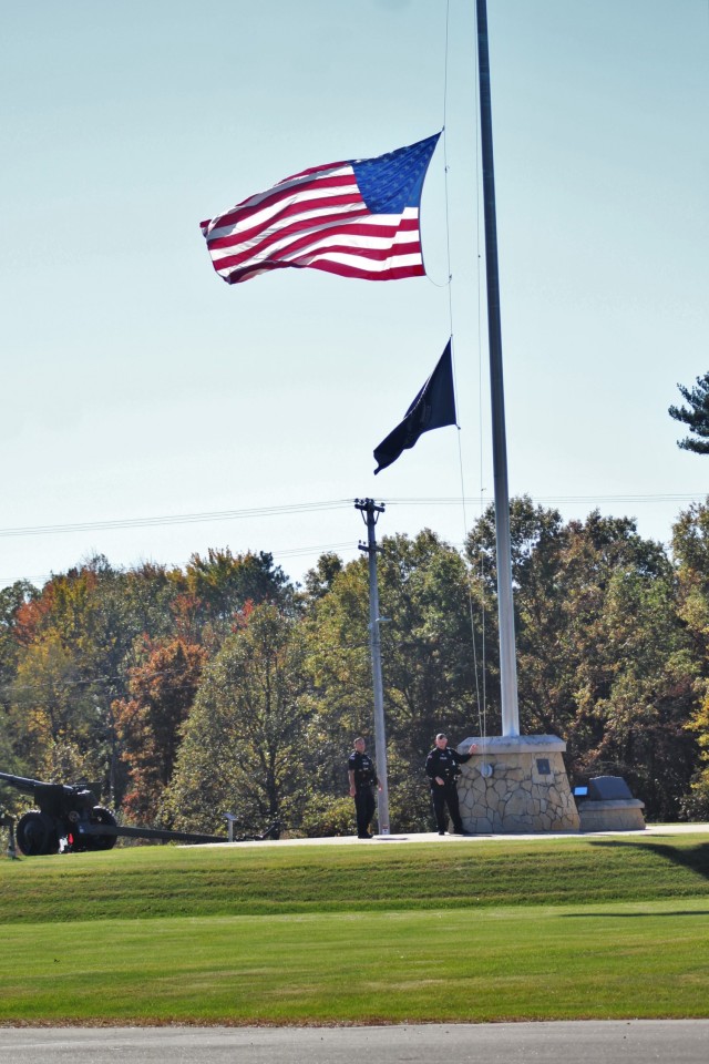 Officers with the Directorate of Emergency Services Police Department finish setting the U.S. flag at half-staff Oct. 18, 2021, at Fort McCoy, Wis., in honor of Army Gen. Colin Powell, who recently died at the age of 84. Powell was the chairman of the Joint Chiefs of Staff during Operation Desert Storm in 1991 and also served four years as the U.S. Secretary of State in the early 2000s. (U.S. Army Photo by Scott T. Sturkol, Public Affairs Office, Fort McCoy, Wis.)