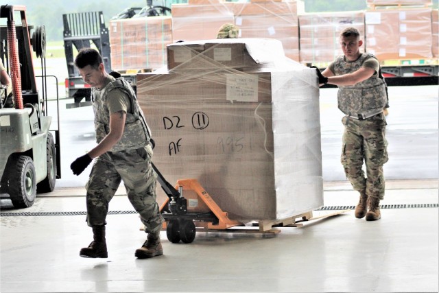 Airmen move cargo Aug. 5, 2021, at the Sparta-Fort McCoy Airport at Fort McCoy, Wis., in preparation for the exercise Patriot Warrior 2021. Patriot Warrior is Air Force Reserve Command's premier exercise, providing an opportunity for Reserve...