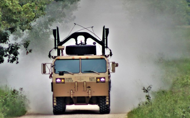 Soldiers operate a military vehicle on a range road July 22, 2021, on a range road on North Post at Fort McCoy, Wis., during operations for the mobilization exercise Pershing Strike '21 at the installation. Thousands of military members trained at...
