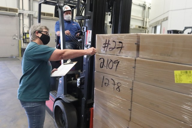 Supply Specialist Tamra Meyer with the Fort McCoy Logistics Readiness Center (LRC) Food Program Management Office checks food content on a pallet Oct. 14, 2021, during food service operations at the LRC Supply Subsistence Management Office in...