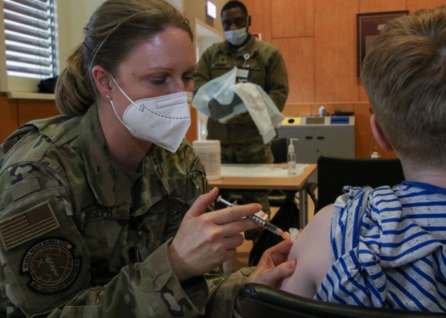 U.S. Air Force Lt. Col. Susan Joseph, nurse practitioner, Family Health Clinic, 86th Medical Group, 86th Airlift Wing, Ramstein Air Base, inoculates a child with the COVID-19 vaccine for ages 5-11 at Landstuhl Regional Medical Center, Nov. 18. LRMC, the largest American hospital overseas, began COVID-19 vaccinations for children ages 5 to 11, becoming one of the first Military Treatment Facilities overseas to vaccinate that patient population.