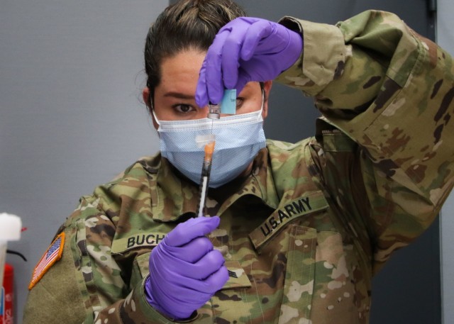 U.S. Army Sgt. Heidy Bucheli, noncommissioned officer in charge, Anesthesiology, Landstuhl Regional Medical Center, prepares a COVID-19 vaccination for children ages 5 to 11 at LRMC, Nov. 18. LRMC, the largest American hospital overseas, began COVID-19 vaccinations for children ages 5 to 11, becoming one of the first Military Treatment Facilities overseas to vaccinate that patient population.