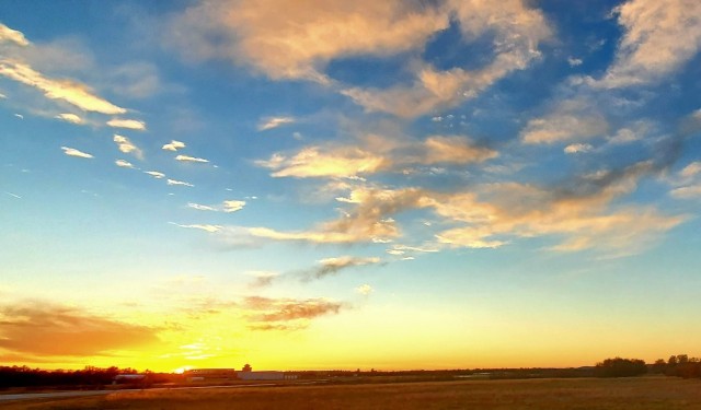 The sun sets behind airport buildings Nov. 9, 2021, at Sparta-Fort McCoy Airport at Fort McCoy, Wis. The airport is often one of the best open areas to catch a colorful sky scene at the installation. Learn more about Fort McCoy online at...