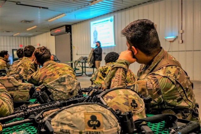 Hunter Heard, instructor with the Fort McCoy Cold-Weather Operations Course, teaches a class for Soldiers with the 1st Squadron, 32nd Cavalry Regiment “Bandits” during training Nov. 12, 2021, at a Fort McCoy, Wis., range as part of Operation...