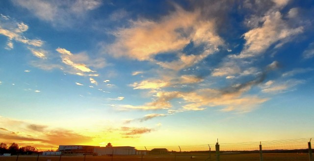 The sun sets behind airport buildings Nov. 9, 2021, at Sparta-Fort McCoy Airport at Fort McCoy, Wis. The airport is often one of the best open areas to catch a colorful sky scene at the installation. Learn more about Fort McCoy online at...