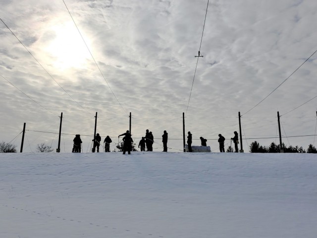 Students in Cold-Weather Operations Course class 21-03 complete field training wearing snowshoes, carrying rucksacks, and pulling ahkio sleds of equipment Jan. 28, 2021, at a training area on South Post at Fort McCoy, Wis. Students complete miles...