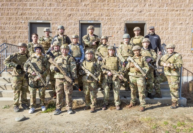 A group of civilian employees from the U.S. Army Combat Capabilities Development Command Soldier Center take a group photo during a Greening training session, led by Soldier Support and Program Integration Team’s Dan Moore (top right), held November 1-5, 2021, at Fort Devens, Massachusetts.