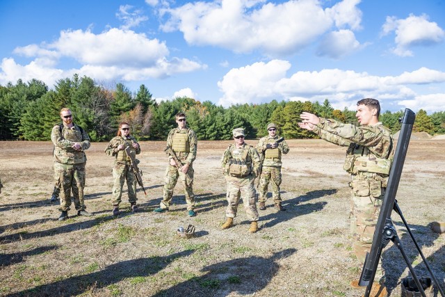 Sgt. Hunter Hey, an infantryman from B Company, 1st Battalion, 325th Airborne Infantry Regiment, instructs civilian employees from the U.S. Army Combat Capabilities Development Command Soldier Center during Greening training, held November 1-5, 2021, at Fort Devens, Massachusetts.