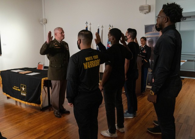 U.S. Army North Commanding General Lt. Gen John Evans, Jr., left,  administers the oath of office to five Partnership for Youth Success (PaYS) future Soldiers at the Plaza de Armas Gallery, San Antonio, Texas, Nov. 19, 2021. The U.S. Army PaYS...