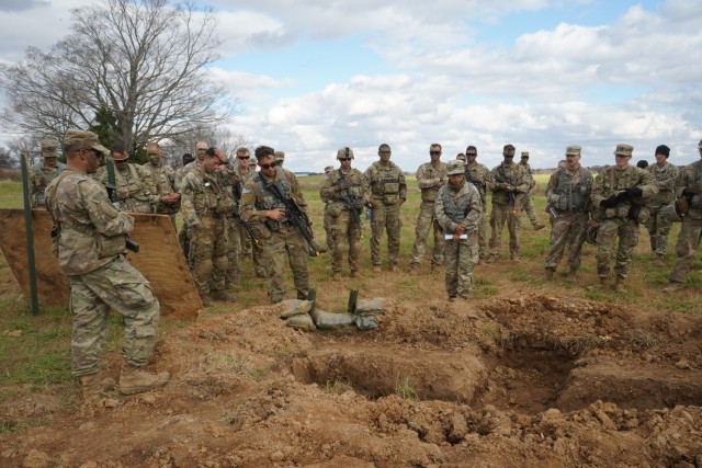 Leaders from the 101st Airborne Division (Air Assault) look at various dug in two person and crew served fighting positions, during a leader professional development training on company, battery, and troop commander survivability, at Fort Campbell, Ky., Nov. 17, 2021. The leaders were shown over time what the construction of a fighting position should look like from begin to final stages. (U.S. Army photo by: Staff Sgt. Sinthia Rosario, 101st Airborne Division Public Affairs)