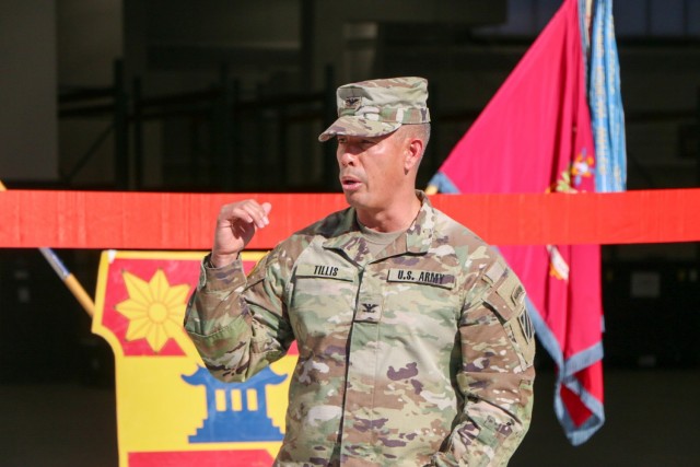 Col. Terry R. Tillis, commander of the "Spartan Brigade," 2nd Armor Brigade Combat Team, 3rd Infantry Division, speaks during the opening ceremony for the opening of the brigade's new supply support activity facility supported and run by the...