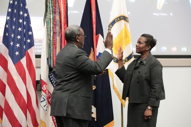 Bobbi. J. W. Davis reaffirms the oath of office upon her appointment to the Senior Executive Service 