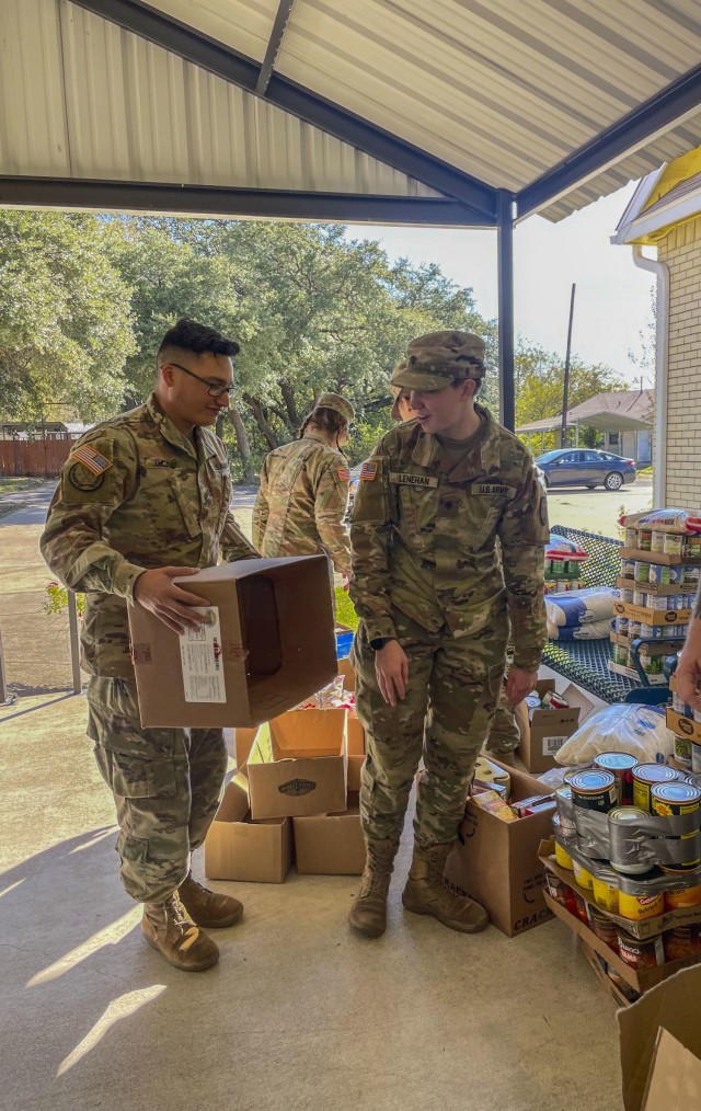 Soldiers with 504th Expeditionary Military Intelligence Brigade sort through food donations, Nolanville, Texas, Nov. 19, 2021. The unit held a food drive and raised 3,414 lbs. of non perishable items. (U.S. Army photo by Sgt. Melissa N. Lessard)
