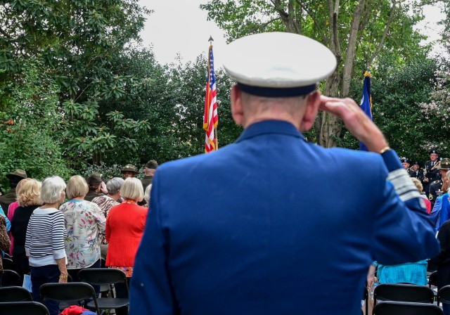 Retired Vice National Commodore of the Coast Guard Auxiliary George Jeandheur salutes the American flag as it is presented during the start of the Garden Club of South Carolina Veterans Day Recognition Ceremony  held Nov. 11. The ceremony was held at the Garden Club’s Memorial Garden on Lincoln Street to honor the service and sacrifices of veterans.