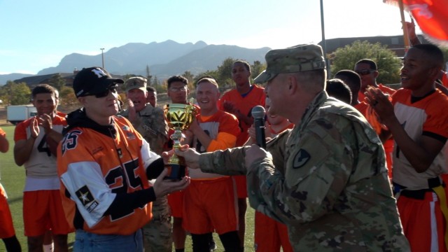 (right) Col. Jarrod Moreland, Commander, U.S. Army Garrison-Fort Huachuca,  presents Command Sgt. Maj. Jason McCoy the 2021 Turkey Bowl.