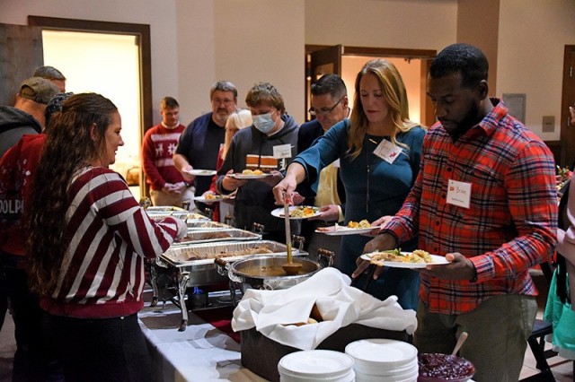 U.S. Army Space and Missile Defense Command volunteers serve Gold Star Families during the Survivor Outreach Services holiday dinner at the Huntsville Botanical Gardens, Nov. 20, 2021. (U.S. Army photo by Carrie David Campbell)
