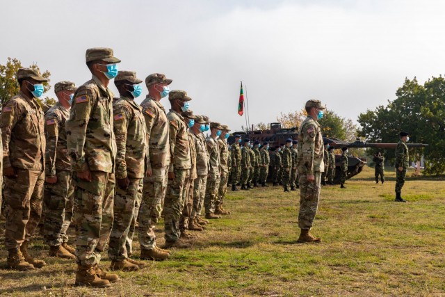 U.S. Army Soldiers with Charlie Company “Bandidos,” 1st Battalion, 16th Infantry Regiment, 1st Armored Brigade Combat Team, 1st Infantry Division and soldiers with the Hellenic Army stand at attention during the opening ceremony of Olympic Cooperation 2021 at Triantafyllides Camp, Greece, Nov. 6, 2021. Olympic Cooperation 2021 is a maneuver and live-fire exercise with Greece and the United States to enhance tactical and operational cohesion among both militaries. 