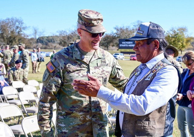 Brig. Gen. Patrick R. Michaelis, Fort Jackson commanding general, talks with Nicholas Garcia, the grandfather of a Soldier who was a part of Family Day activities earlier in the day, during the post’s National Native American Heritage Month celebration on Nov. 17 at Darby Field. Garcia happened to be attending his grandson’s Family Day when he learned of the celebration event and attended.