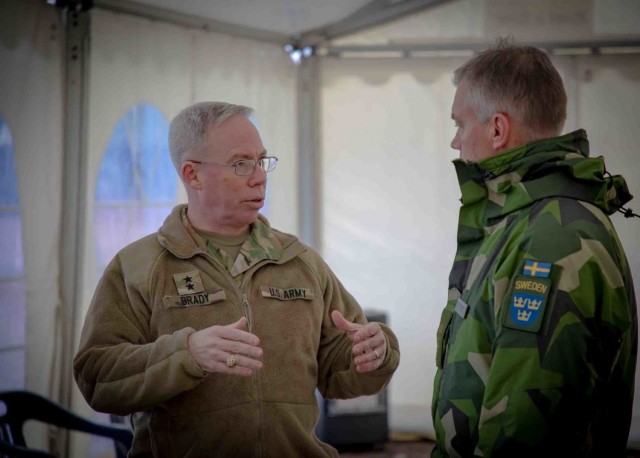 Maj. Gen. Greg Brady, commander of the 10th Army Air & Missile Defense Command, discusses interoperability with senior leaders from the Swedish Armed Forces during a handover ceremony in Halmstad, Sweden on November 18, 2021. (U.S. Army Photos by Sgt. 1st Class Terrance D. Rhodes)