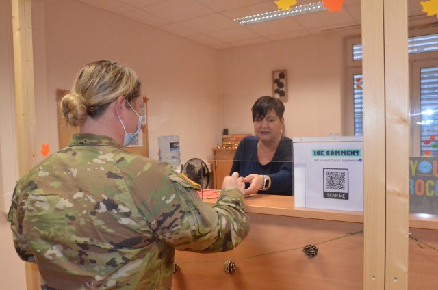 A MPD customer service representative assists a Soldier in-processing at Kleber Kaserne.