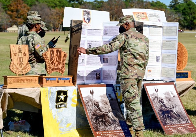 Sgt. 1st Class Robert Williams, Soldier Support Institute, reads about prominent Native Americans presented in a display during the Fort Jackson National Native American Heritage Month celebration Nov. 17 at Darby Field. Two guest speakers introduced attendees to the Comanche code talkers who helped win World War II and the warrior culture shared by all native tribes.