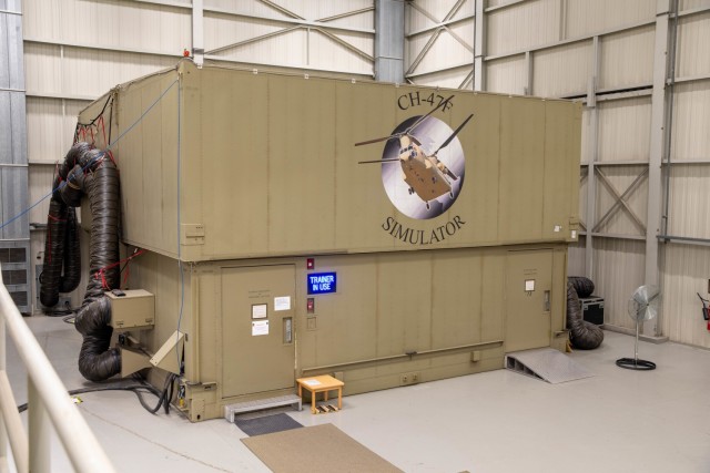 The exterior of the CH-47F Chinook helicopter simulator sits inside of the Illesheim Flight Simulator Complex at Storck Barracks in Illesheim, Germany, Nov. 17, 2021. These simulators provide safe practice of flight operations in a controlled environment and give instant feedback of crew member training. 