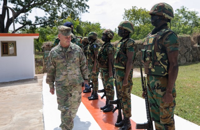 U.S. Army Gen. Christopher Cavoli inspects a formation of Ghana army soldiers in Tamale, Ghana, Nov. 16, 2021. Cavoli, commanding general of U.S. Army Europe and Africa, visited Ghana to meet with senior defense officials of the W. Africa country. (Photo courtesy U.S. Embassy Accra.)
