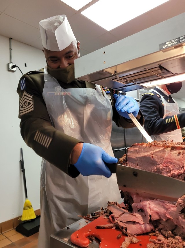 U.S. Army Command Sgt. Maj. Quentin Fenderson, the senior enlisted advisor of the 3rd Infantry Division serves Soldiers at the Marne Bistro’s Thanksgiving luncheon at Fort Stewart, Georgia, Nov. 23, 2021. Leaders from across the 3rd ID came...