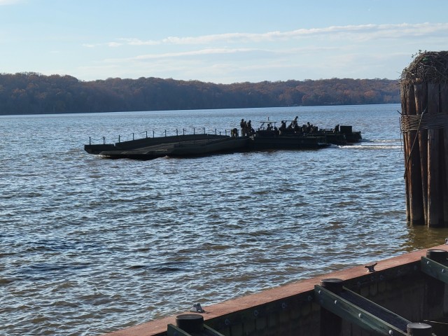 The 299th Multi-Role Bridge Company works to complete a five-float raft at Fort Belvoir to demonstrate the capability on 18 Nov. Photo by Maj. William C. Allred, 412th TEC PAO