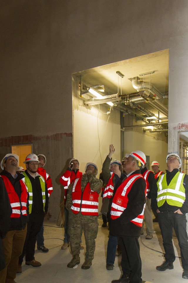 U.S. Army Corps of Engineers Project Manager Sibylle Ballnath points out features of the under-construction Wiesbaden Middle School to then U.S. Army Corps of Engineers Commander Lt. Gen Todd Semonite during a site visit in November 2018....