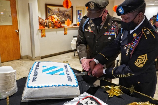 U.S. Army Lt. Col. Daniel Pecha and Command Sgt. Maj. Curtis Reid, command team of 1st Battalion 28th Infantry Regiment, 1st Armored Brigade Combat Team, 3rd ID cut the cake for Soldiers during the Thanksgiving meal at the 75th Ranger Regiment...