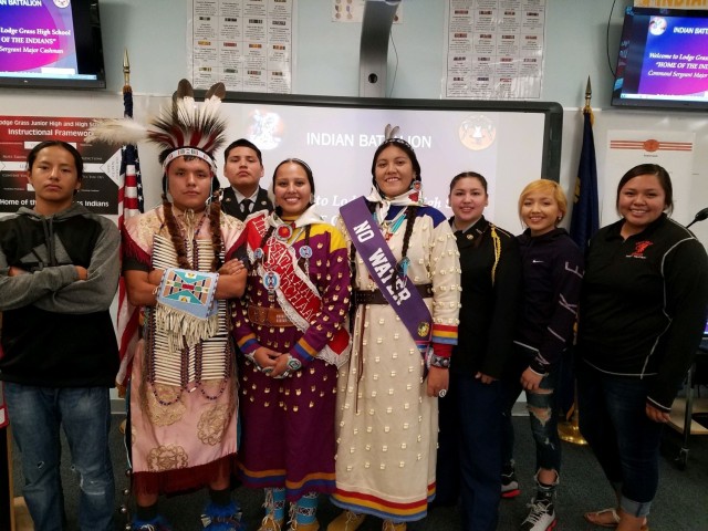 Students from Lodge Grass High School JROTC in Lodge Grass, Mont. pose for a photo on Nov. 23, 2021 wearing their uniforms and Native American regalia. The program at Lodge Grass is one of only three JROTC programs in Montana. | Photo courtesy of Lt. Col. (Ret.) Michael Rubi.