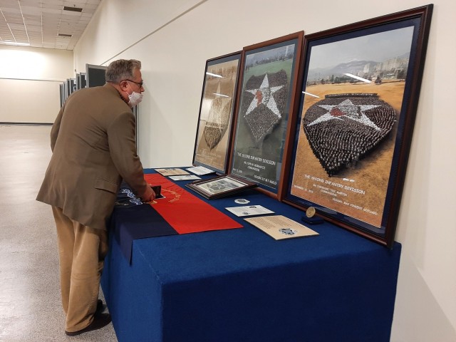 David Schlesinger, a civil engineer, U.S. Army Corps of Engineers, Far East District (FED) looks at the photos of the Second Infantry Division’s “Living Insignia” displayed at the 2ID and Eighth Army Korea Theater of Operations Museum in...