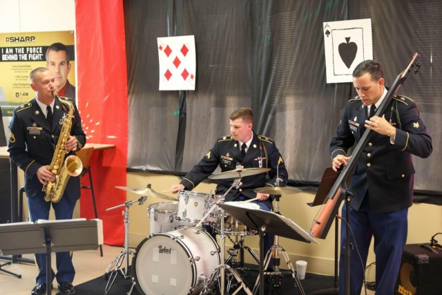 U.S Army Soldiers assigned to the 3rd Infantry Division, play music at the Spartan Dining Facility restaurant at Fort Stewart, Georgia, Nov. 24, 2021. Serving the Thanksgiving luncheon is a time-honored tradition for leaders to show appreciation...