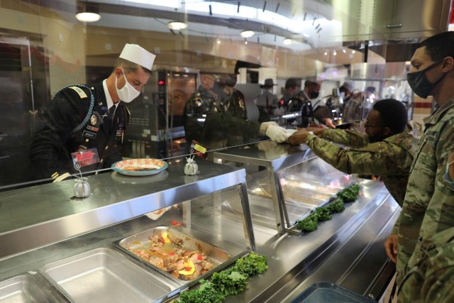 U.S Army Soldiers assigned to 3rd Infantry Division serve Soldiers and Family members at a Thanksgiving luncheon at Fort Stewart, Georgia, Nov 24, 2021. Serving the Thanksgiving luncheon is a time-honored tradition for leaders to show appreciation...