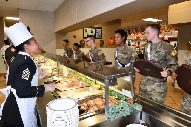 Command Sgt. Maj. Chalawnda M. Kelley, 232nd Medical Battalion, serving Thanksgiving meal at Slagel Dinning Facility.
