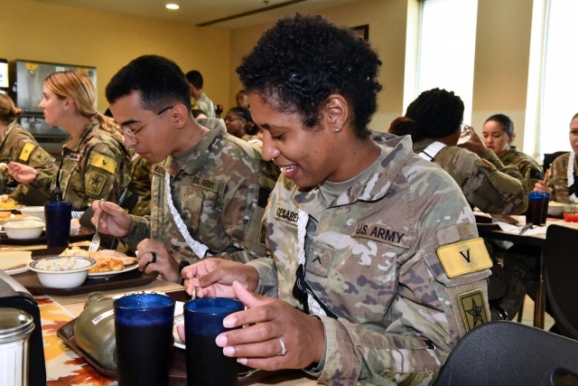 Pvt.  Xiomara Cesareo and Pvt.  Maximiliano Bueno enjoys his Thanksgiving meal at the Slagel Dinning Facility.  For both soldiers, it was their first Thanksgiving away from home.