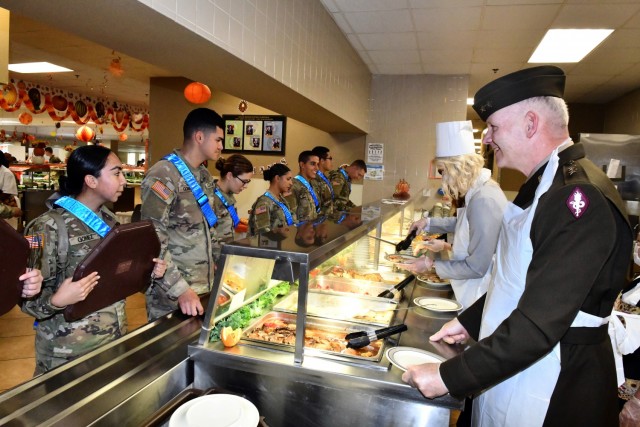 Maj. Gen. Dennis P. LeMaster enjoys asking AIT Soldiers what they would like to eat as he serves Thanksgiving meals at Slagel Dinning Facility, Fort Sam Houston.