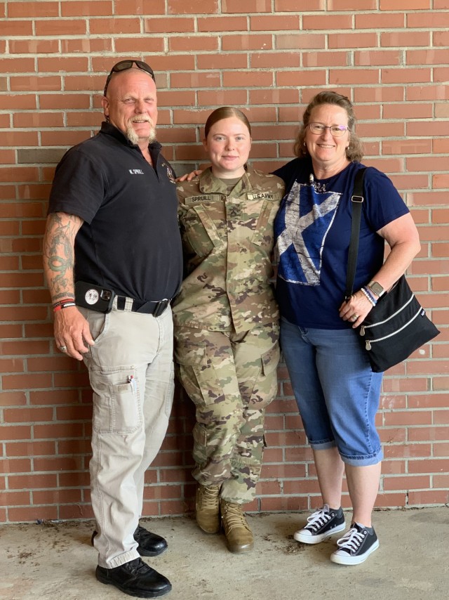 Sgt. Catherine E. Spruill, a wheeled vehicle mechanic assigned to the Fort Bragg, N.C., based 3rd Expeditionary Sustainment Command, poses with her parents, Woody and Sarah, in August before deploying to Camp Arifjan, Kuwait. “My parents, I love them to death, they’re such wonderful people,” she said. (Photo courtesy of Sgt. Catherine E. Spruill)