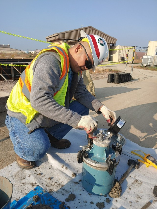 Glenn Sacro, a Far East District Kunsan Resident Office quality assurance representative, conducts concrete field testing during construction of project HAS 4-6 (2019UMMA031), a host-nation funded project that will construct 18 new Hardened...