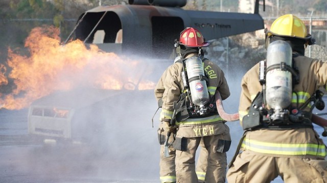 USAG Daegu firefighters rush to put out a controlled fire during live burn training at Camp Carroll. The training, which was conducted 15-19 November 2021, helps prepare the firefighters for dealing with real-world scenarios.