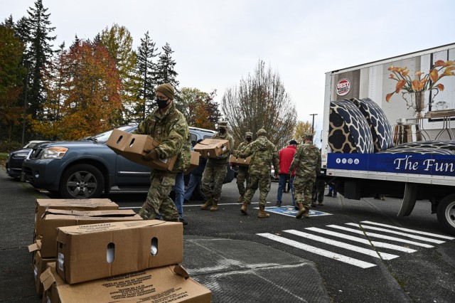 U.S. Air Force Airmen with Team McChord and volunteers from the local community help distribute turkeys during Operation Turkey Drop at Joint Base Lewis-McChord, Wash., Nov. 18, 2021. The Air Force Association McChord Field Chapter and the Pierce...