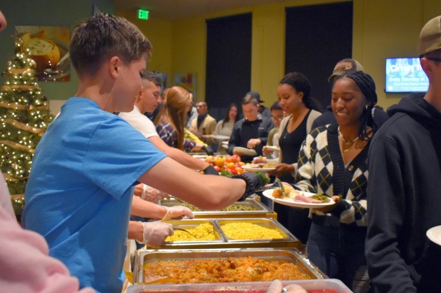 Volunteers from the Presidio of Monterey Better Opportunities for Single Service members program serve a traditional Thanksgiving dinner at the Staff Sgt. Kenneth R. Hobson Recreation Center, PoM, Calif., Nov. 25.