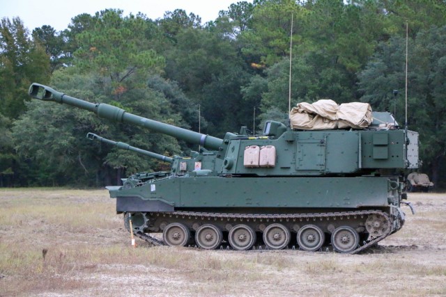 Modernized Paladin M109A7 howitzers, assigned to the “BattleKings Battalion,” 1st Battalion, 9th Field Artillery Regiment, 2nd Armor Brigade Combat Team, 3rd Infantry Division, prepare to fire for the first time during artillery Table VI...