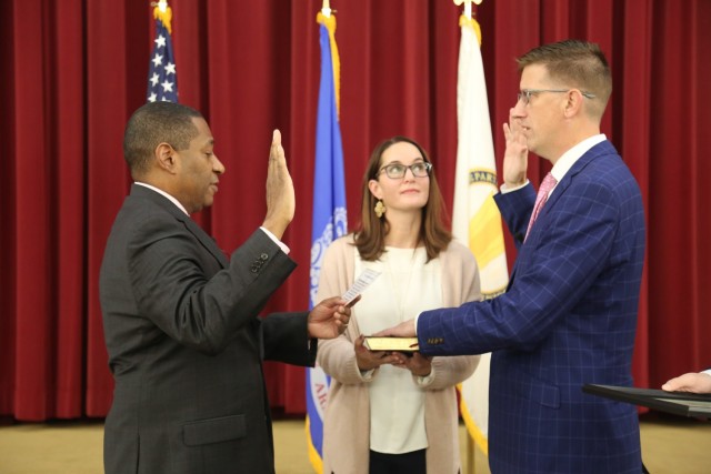 DEVCOM CBC Engineering Director, Michael Bailey was inducted into the Senior Executive Service Corps Nov. 10. Center Director Dr. Eric Moore officiated for the ceremony as Deborah Bailey held the Bible.
