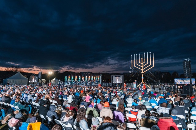 Guests take part in the National Menorah lighting arranged by Chabad-Lubavitch at the Ellipse in Washington, D.C. on November 28, 2021, the first night of the eight-day holiday.